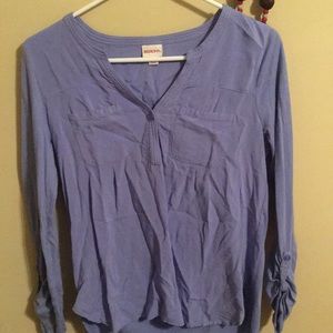 Small, purple shirt. Soft material.